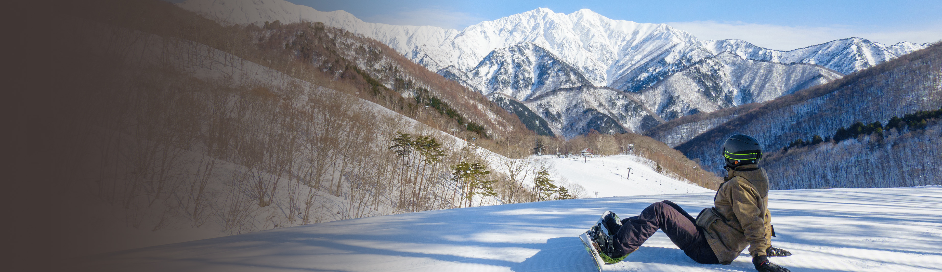 鹿島槍スキー場ゲレンデ景色とスノーボーダー